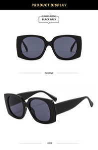 Detail view of black square sunglasses with textured temples and grey lenses