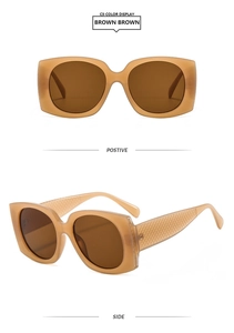Detail view of square frame brown sunglasses featuring textured quilted pattern temples