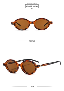 Détails de lunettes de soleil ovales marron léopard avec texture tortue et verres foncés