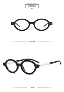Vue détaillée des lunettes punk ovales avec monture noire et branches bicolores noir et blanc