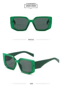 Detail view of emerald green square frame sunglasses with thick temples and gray lenses