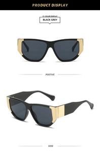 Macro view of square thick-frame sunglasses with bold gold metal temple details