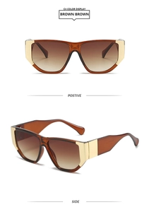 Detail view of square brown translucent sunglasses with decorative gold metal accents