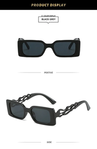 Detail view of rectangular sunglasses with unique flame cutout temples and grey lenses