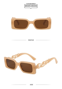 Detail of cream brown square sunglasses featuring hollow flame-shaped temple design