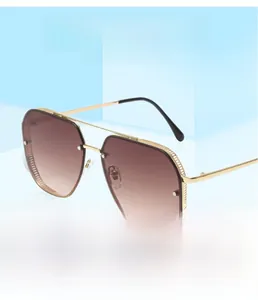 Close-up of golden aviator sunglasses with mesh side details and brown gradient lenses