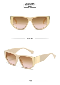 Detail view of beige square sunglasses with brown pink gradient lenses and gold metal accents