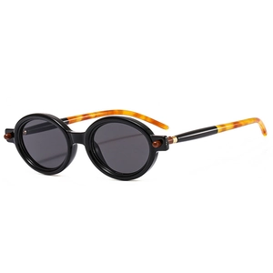 Lunettes de soleil ovales rétro avec monture noire et branches en écaille de tortue