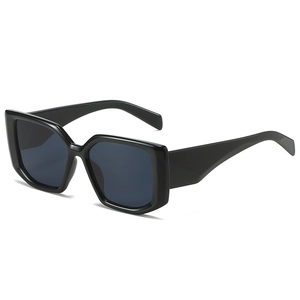 Fashionable oversized square black frame sunglasses with deep grey lenses in retro style