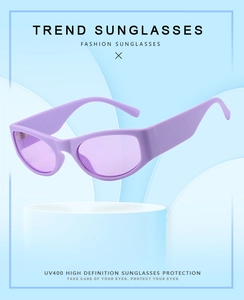 Detail of trendy purple Y2K sunglasses with UV400 protection on a display stand