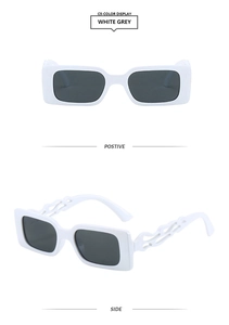 Detail of white rectangle sunglasses with creative hollow flame temples and grey lenses