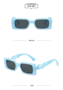Detailed view of blue grey square sunglasses with unique flame-shaped hollow temples