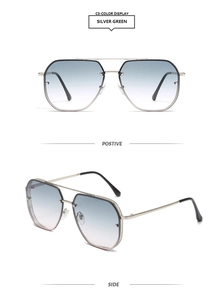 Detailed views of vintage pilot sunglasses with double bridge and silver green metal frames