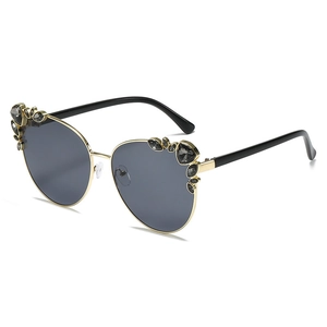 Fashionable cat eye metal sunglasses with crystal embellishments and dark lenses