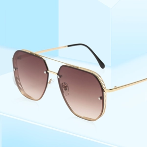 Retro pilot sunglasses with gold metal frame and brown gradient lenses in a 45-degree view