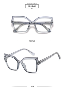 Detail view of stylish square fog blue cat-eye glasses frames with a translucent finish