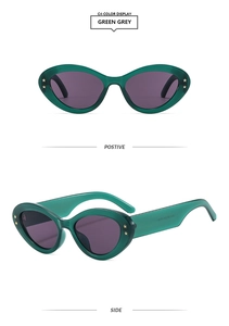 Green grey oval cat-eye sunglasses with star accents in front and side views