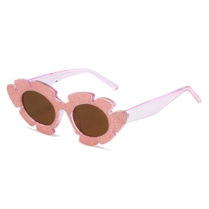 Rosafarbene Glitzer-Sonnenbrille für Mädchen mit schicken Blumenrahmen-Details