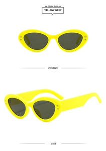 Detailed front and side views of yellow cat eye sunglasses with star rivets on white background