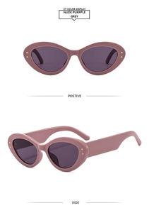 Detail view of cat eye sunglasses in nude purple with gold star rivet accents