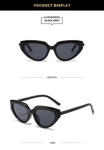 Front and side view of Y2K cat-eye sunglasses with glossy black frames and grey lenses