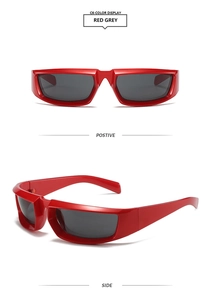 Detail view of red frame Y2K sports sunglasses with dark grey rectangular lenses
