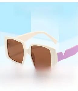 Detail of square off-white frame sunglasses with purple geometric temples and brown lenses