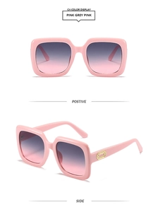 Close-up of pink square sunglasses with gradient lenses and gold oval temple detail