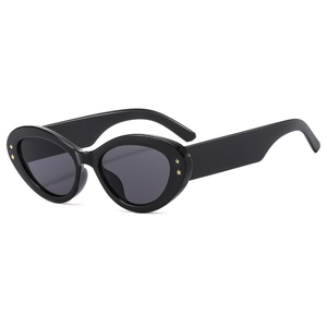Chic black cat eye sunglasses with gold star rivets and dark grey tinted lenses