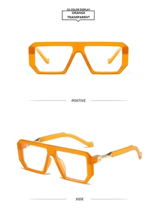 Detail view of large square orange transparent frames with golden metal hinges