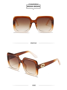 Detail of square oversized sunglasses with brown gradient lenses and gold temple accents