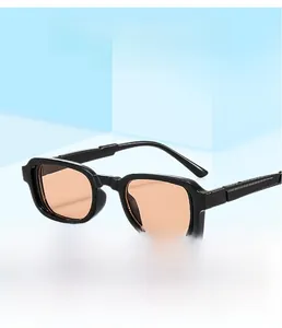 Square black sunglasses with orange lenses displayed on a blue geometric background