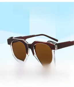 Detail view of irregular layered square sunglasses with burgundy and clear frames