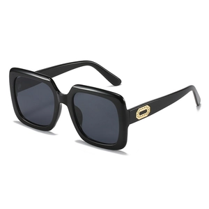 Fashionable square oversized black sunglasses with gold metal decorative hinges