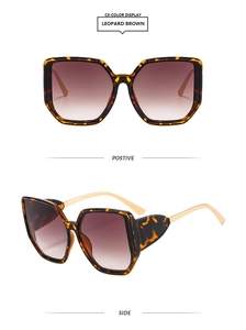 Detail view of leopard brown square sunglasses with gold metal temples and gradient lenses