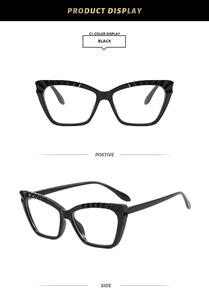 Detail view of black cat-eye TR90 frames with geometric texture on the upper rim