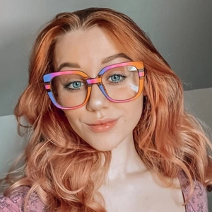 Fashionable oversized cat-eye sunglasses with colorful striped frames for women