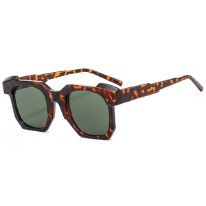 Fashionable square tortoise shell sunglasses with dark green lenses and geometric frames