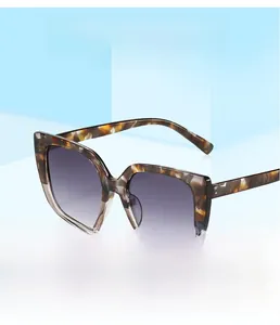 Detail of gradient lenses and tortoise shell frames on oversized square sunglasses