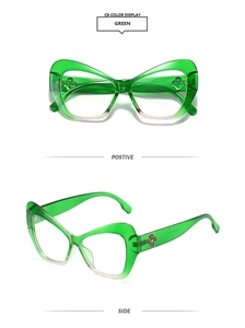 Detail of green cat-eye sunglasses with golden clover logo on the temple hinge