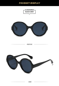 Vues de face et de côté des lunettes de soleil rondes noires avec verres gris foncé
