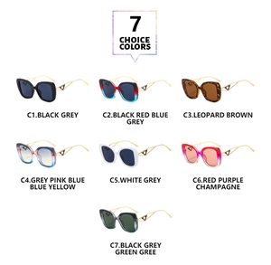 Macro shot of stylish square sunglasses featuring colorful lenses and gold metal temples