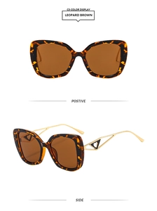 Close-up of leopard square sunglasses with gold temples and hollow heart detail