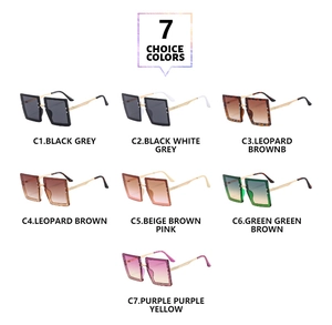 Detail view of seven square oversized sunglasses with gold textured metal temples