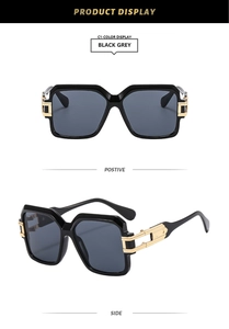 Detail of black square sunglasses featuring elegant gold hollow metal decor on temple