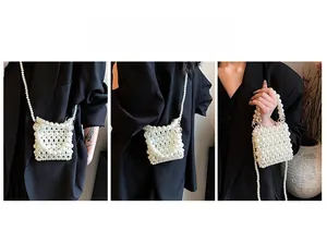 Detail of handmade pearl crossbody bag with beaded strap and metal ring handle