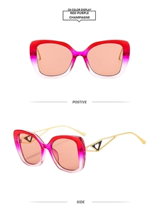 Detail of Y2K sunglasses showing red purple gradient frames and gold hollow temples
