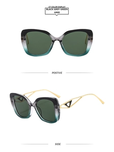 Detail of square gradient frame sunglasses with gold heart hollowed temples and green lenses