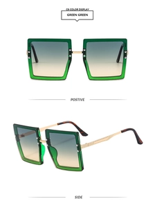 Detail of square oversized green gradient sunglasses with golden metal hinges and temples
