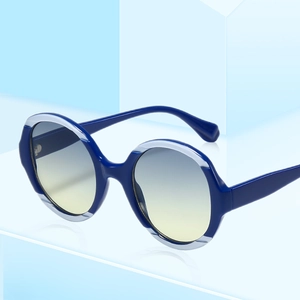 Lunettes de soleil rondes rétro avec monture bleu marine et verres dégradés modernes